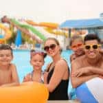 Happy family at a water park for spring break