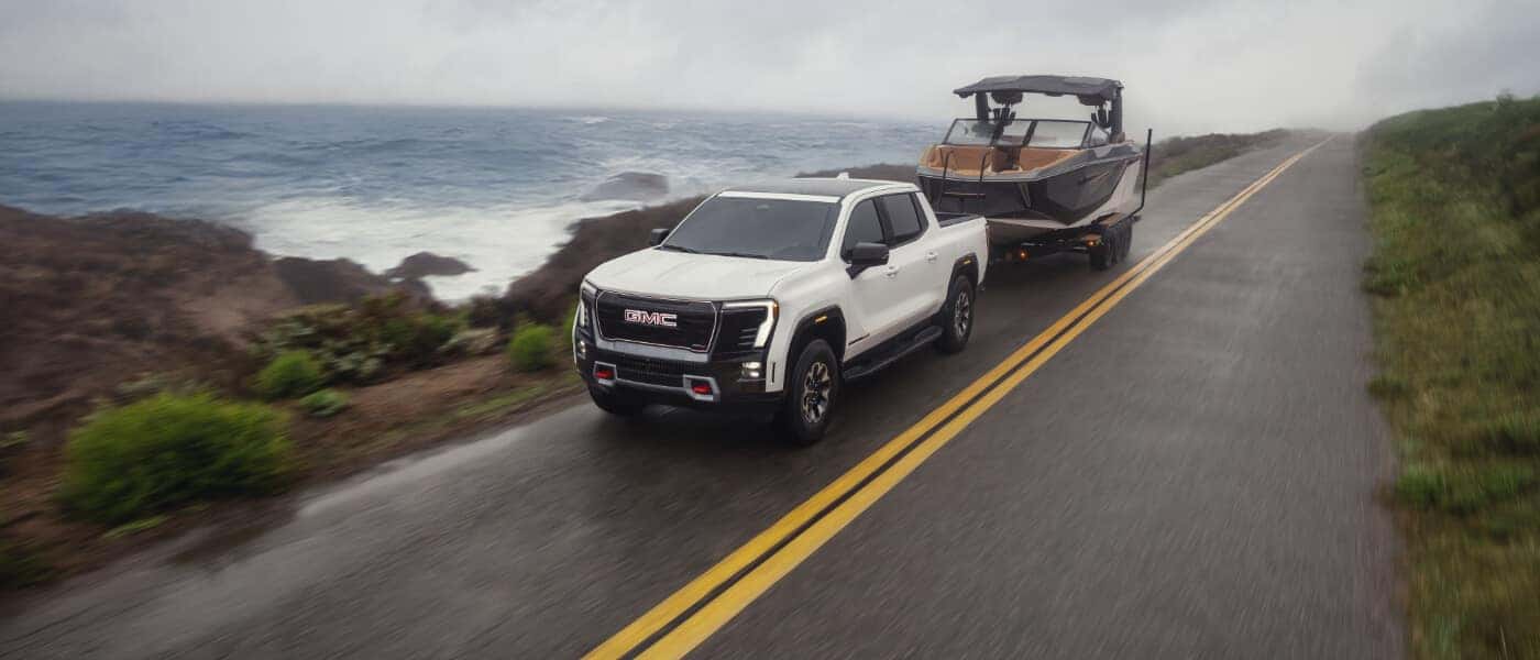 2026 GMC Sierra EV Exterior Pulling Boat