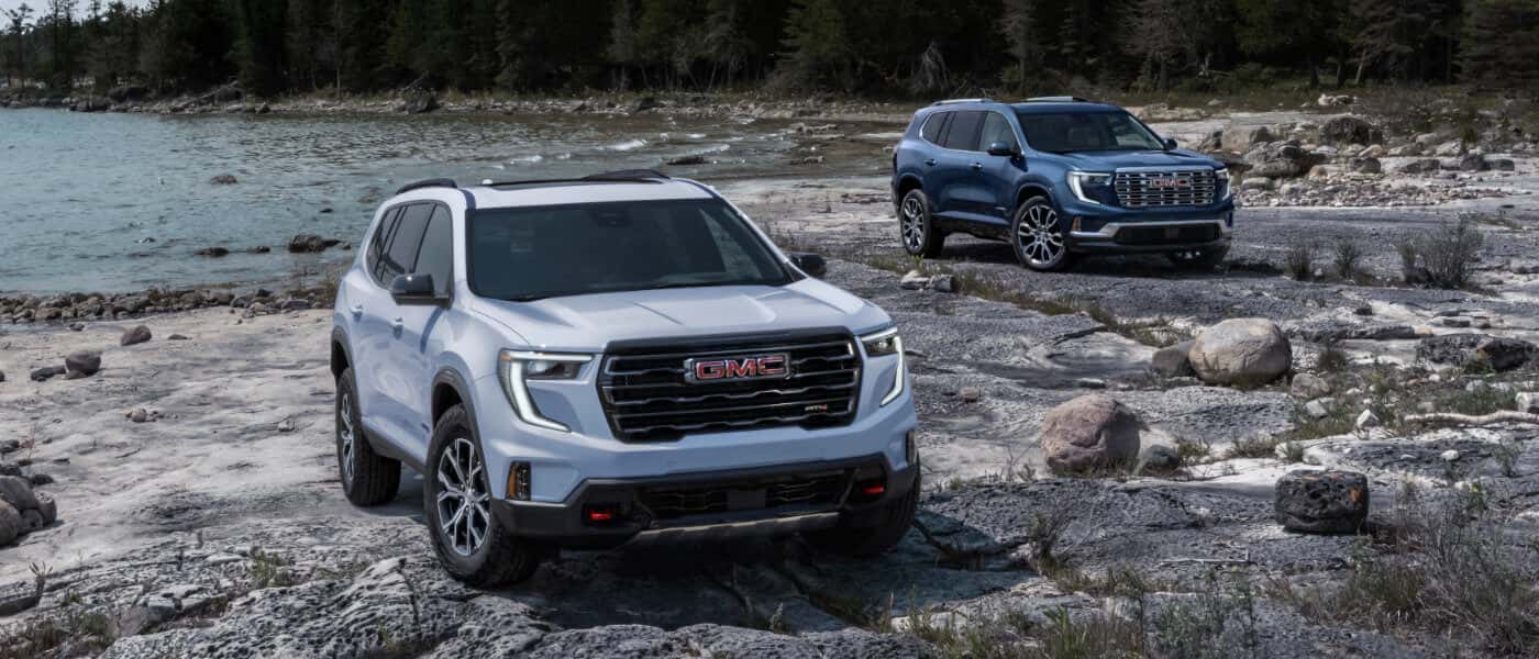 2027 GMC Acadia pair on a beach