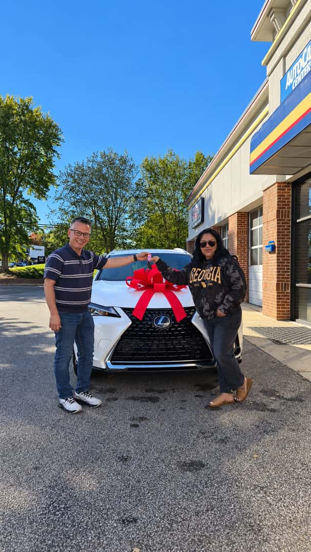 Customer receiving a Lexus at Auto Gallery