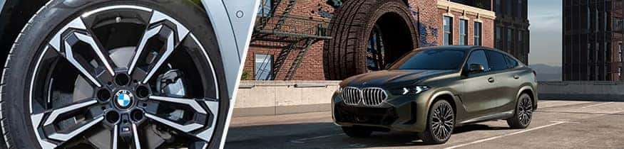BMW TIRE AND BMW X6 WITH WAREHOUSE BACKGROUND
