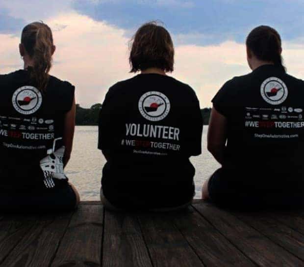 3 people sitting with backs to camera