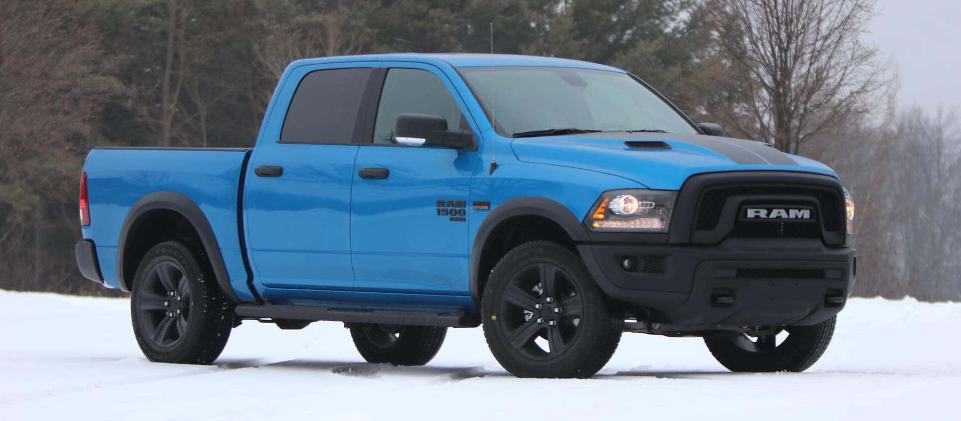 Blue Ram 1500 in snow