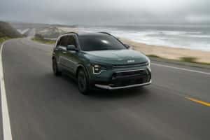 2023 Green Niro EV driving on the road