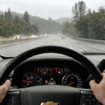 Chevrolet Tahoe with StabiliTrak active on wet I-80 in Auburn.