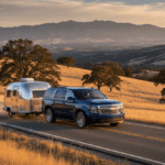 Chevrolet Tahoe towing small trailer through Placer County hills near Auburn CA