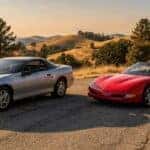 Used Chevy Camaro vs used Corvette parked on a California foothills road near Auburn, CA