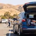 2026 Chevrolet Equinox with liftgate open loaded with back-to-school supplies in a busy Roseville parking lot