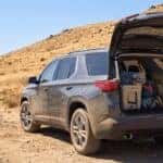 2026 Chevrolet Traverse with liftgate open at a Sierra Nevada foothills trailhead in summer