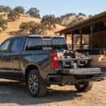 2026 Chevrolet Silverado 1500 truck bed with organized storage bins and lumber at an Auburn, CA foothill lumber yard