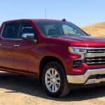 2026 Chevrolet Silverado 1500 with protected paint finish parked in open Auburn California summer sun, Sierra Nevada foothills in the background