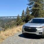 2027 Chevrolet Traverse at the Foresthill Bridge overlook near Auburn, California, with the 730-foot bridge over the North Fork American River canyon visible in the background