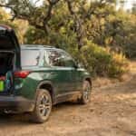 2026 Chevrolet Traverse with liftgate open at an Auburn SRA trailhead, loaded with family hiking gear for Confluence Trail