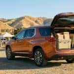 2026 Chevrolet Traverse liftgate open with picnic supplies loaded outside an Auburn, CA country market in summer