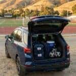 2026 Chevrolet Equinox with rear liftgate open loaded with soccer bags and sports gear at an Auburn CA school athletic field
