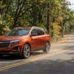 2026 Chevrolet Equinox on the CA-49 scenic corridor through fall foliage in the Sierra Nevada foothills near Auburn, CA