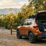 2026 Chevrolet Trailblazer ACTIV at an Auburn SRA trailhead on Foresthill Road with loaded cargo area open, fall foliage in Sierra Nevada foothills