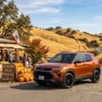 2026 Chevrolet Trailblazer parked near a Gold Country roadside market on Lincoln Way in Auburn, CA, with Sierra Nevada foothills in the background