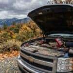 DIY battery check on a Chevrolet truck in the Auburn California Sierra Nevada foothills, hands on electronic load tester under open hood