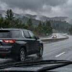 2026 Chevrolet Traverse driving on wet I-80 near Auburn CA with wipers and headlights on in rain