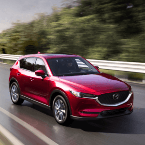 CX-5 driving down road
