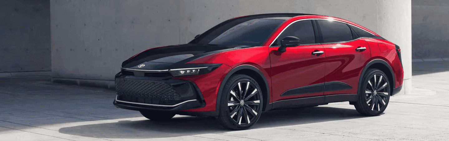 2023 Toyota Crown red in front of building