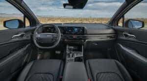 interior of 2026 Kia Sportage, showing dash, screens, and steering wheel