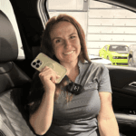 Allye holding her phone in the 2026 Kia Sportage