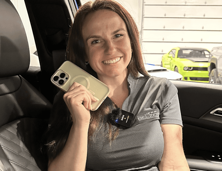 Allye holding her phone in the 2026 Kia Sportage