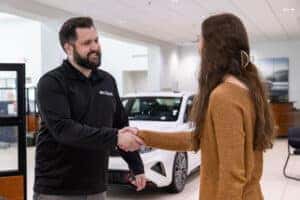 Sales Consultant and Client Shaking Hands