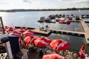 Boating dock at Charlies on Prior and outdoor seating with umbrellas 