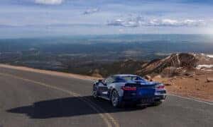 Blue Chevrolet Corvette ZR1 looking over mountains