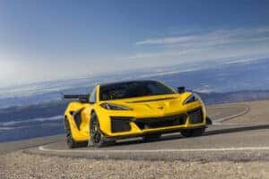 yellow Chevrolet Corvette ZR1 driving on road
