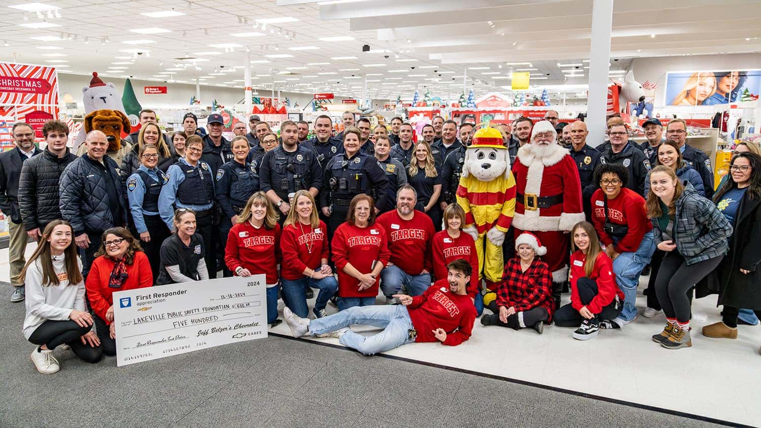 group photo with first responders and Target employees at Shop with a Hero event