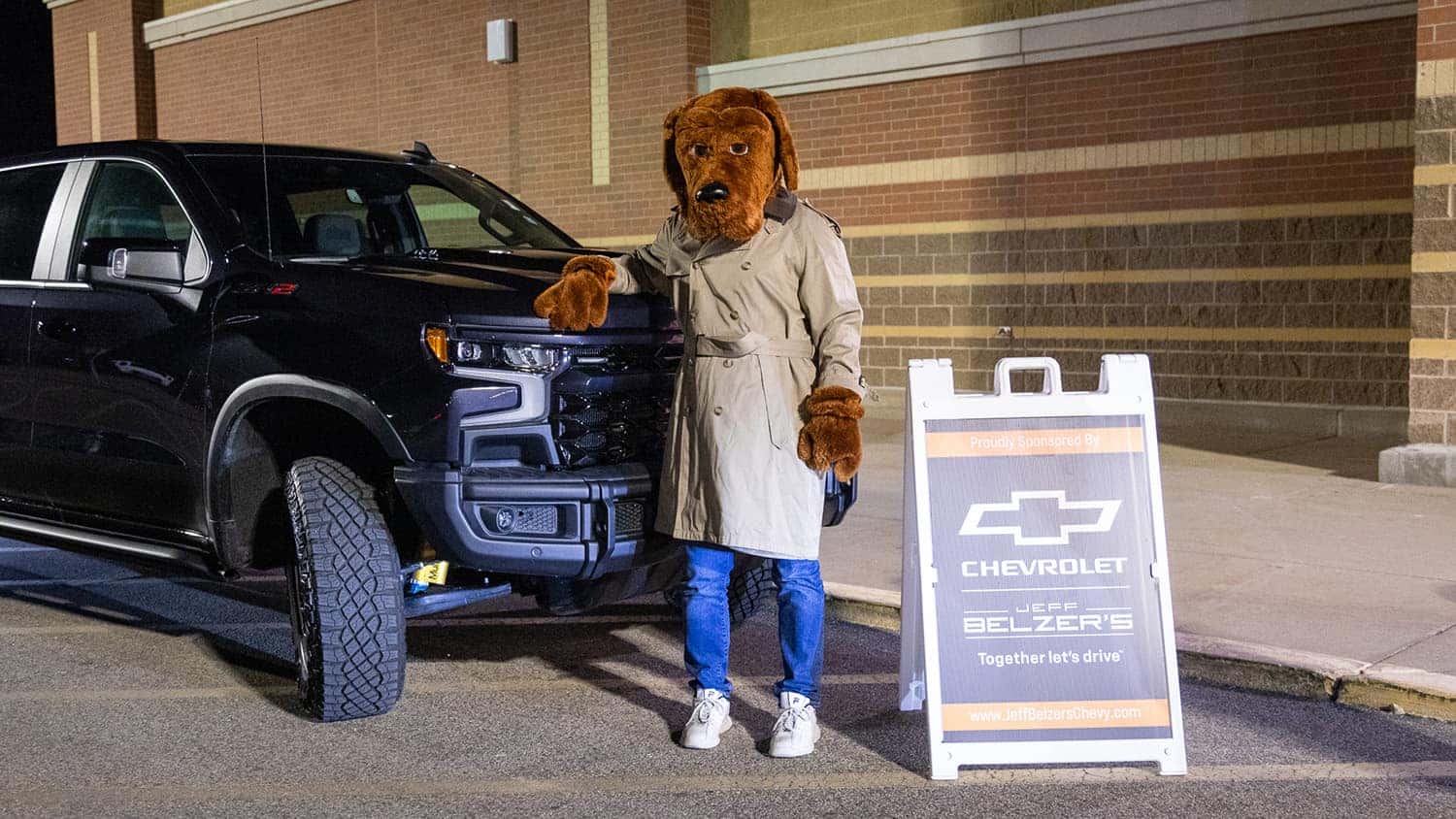 McGruff in front of a Chevrolet Silverado at Shop with a Hero event