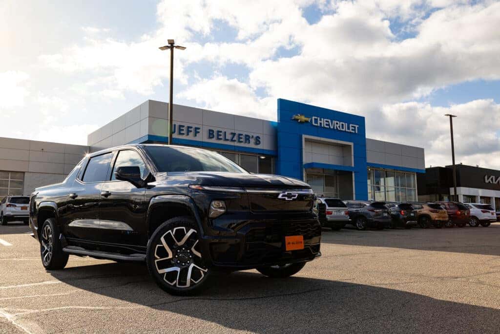 black Silverado EV parked in front of Jeff Belzer's Chevrolet