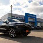 black Silverado EV parked in front of Jeff Belzer's Chevrolet