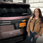 woman standing in front of the tailgate on the 2025 Chevrolet Traverse