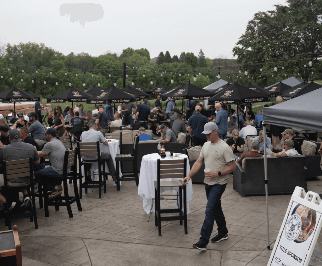 crowd of people enjoying bourbon and cigars event