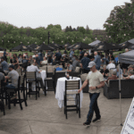 crowd of people enjoying bourbon and cigars event