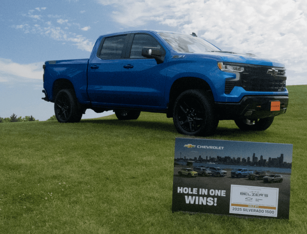 Chevrolet Silverado with sign that says "win this vehicle"