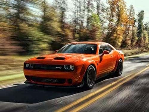 2023 Dodge Challenger driving down a road