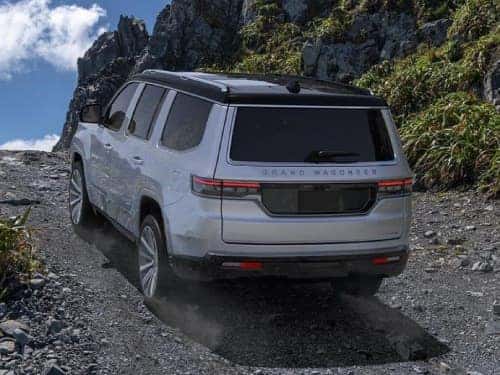 2024 Grand Wagoneer offroading up a rocky path