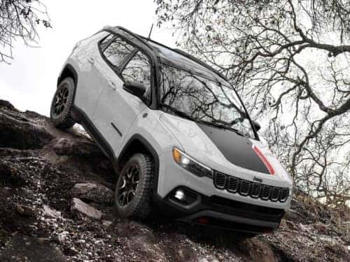 2025 Jeep Compass driving down a steep hill