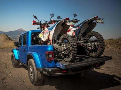 2025 Jeep Gladiator hauling two dirtbikes