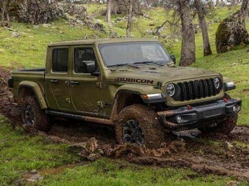 2025 Jeep Gladiator offroading on a muddy trail