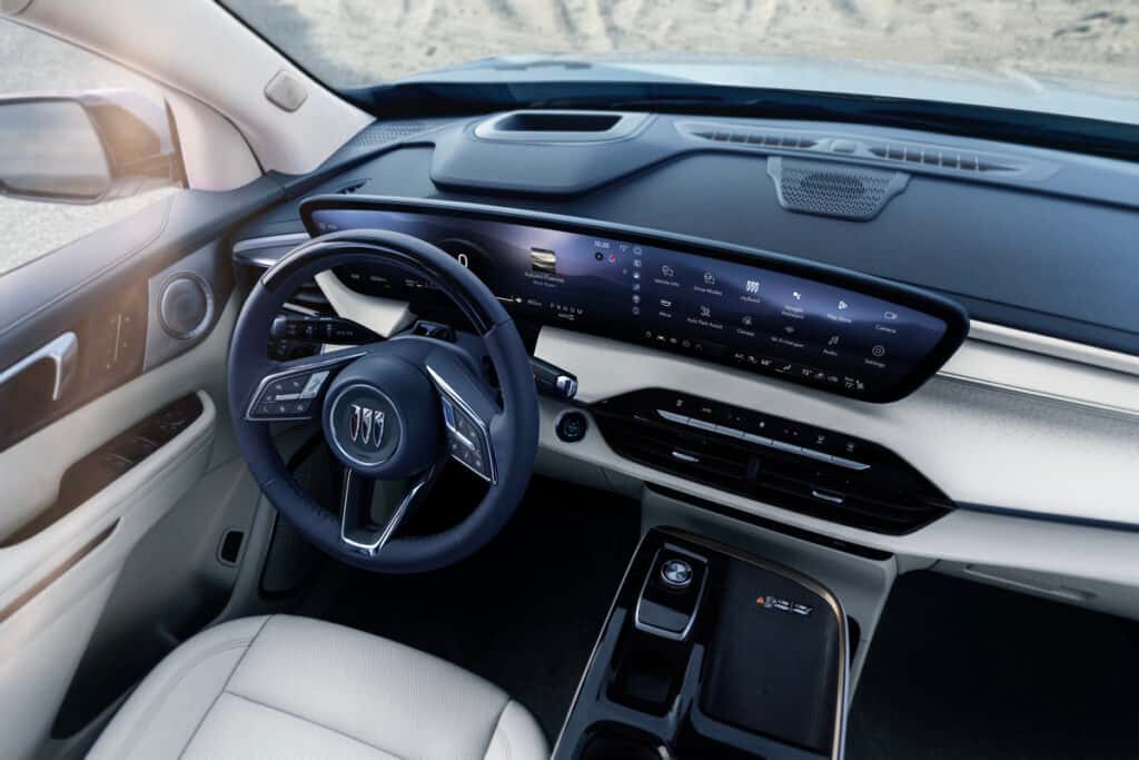 Interior of the 2025 Buick Enclave showcasing luxurious leather seating and panoramic sunroof