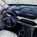 Interior of the 2025 Buick Enclave showcasing luxurious leather seating and panoramic sunroof