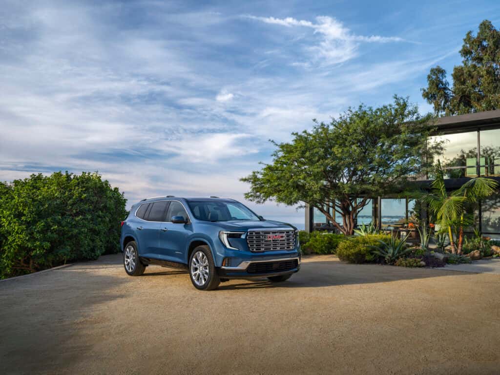 2025 GMC Acadia Denali parked in front of Florida sunset