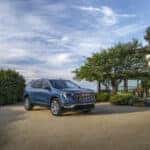 2025 GMC Acadia Denali parked in front of Florida sunset